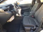2025 Toyota Corolla Hybrid Le Black vin: JTDBCMFE7S3098407