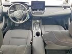 2025 Toyota Corolla Hybrid Le Silver vin: JTDBCMFEXS3092536