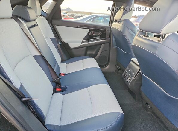 JTMABABA2RA063117 2024 SUBARU SOLTERRA Черный Вид задней части салона