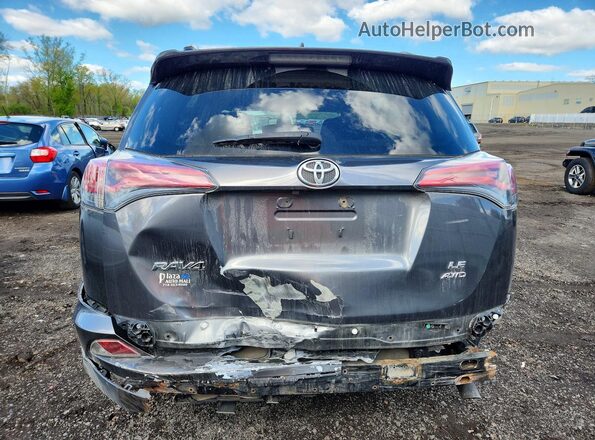 JTMBFREV1GJ056517 2016 TOYOTA RAV4 Charcoal Vista trasera