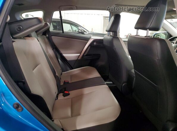 JTMDFREV9GD180462 2016 TOYOTA RAV4 Blue Rear interior view
