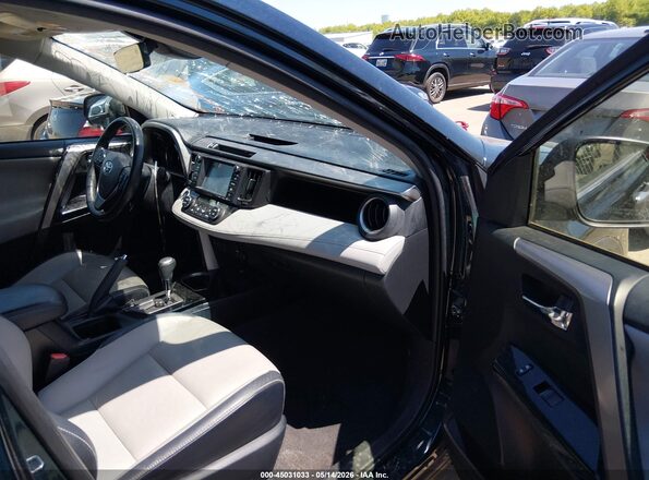 JTMDFREV9JJ185427 2018 TOYOTA RAV4 Синий Вид салона спереди