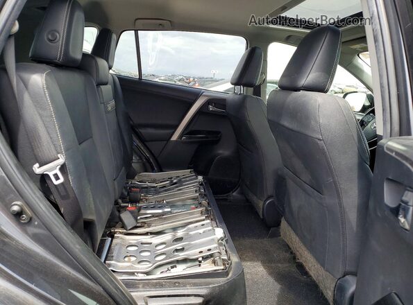 JTMDJREV7GD053773 2016 TOYOTA RAV4 Black Widok tylnych siedzeń