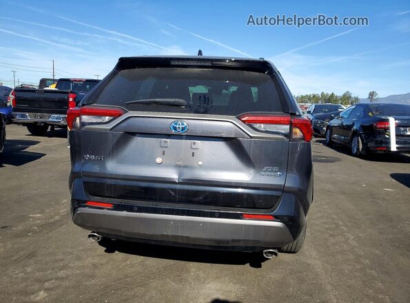 JTMEWRFV0KD521047 2019 TOYOTA RAV4 Gray Rear view
