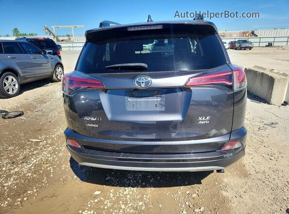 JTMRFREV4JJ723229 2018 TOYOTA RAV4 Gray Vista trasera