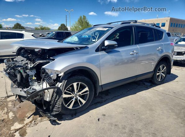 JTMRFREV5JJ211172 2018 TOYOTA RAV4 Серебряный Передняя левая четверть