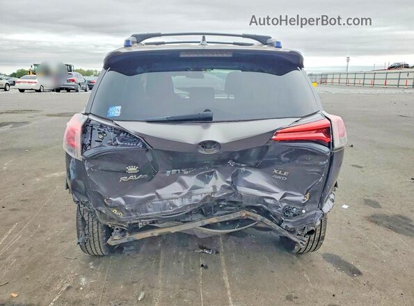 JTMRFREV8HJ129852 2017 TOYOTA RAV4 Gray Rear view