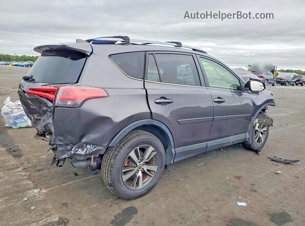 JTMRFREV8HJ129852 2017 TOYOTA RAV4 Gray Rear right
