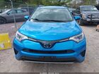 2018 Toyota Rav4 Hybrid Le Blue vin: JTMRJREV3JD245799