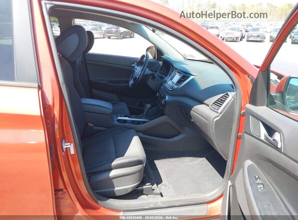 KM8J33A21GU057738 2016 HYUNDAI TUCSON Оранжевый Вид салона спереди