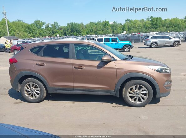 KM8J33A23GU181316 2016 HYUNDAI TUCSON Коричневый Вид задней части салона