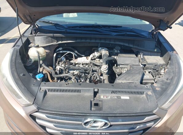 KM8J33A23GU181316 2016 HYUNDAI TUCSON Коричневый Вид сзади