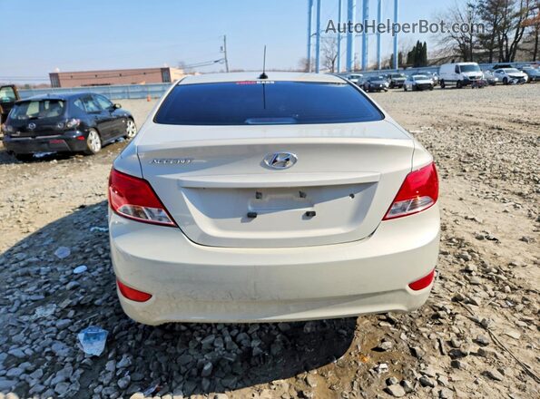 KMHCT4AE9GU010448 2016 HYUNDAI ACCENT Cream უკანა ხედი