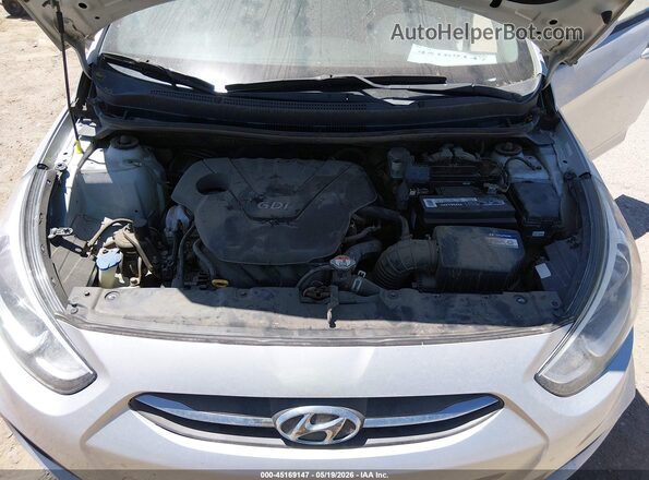 KMHCT5AE4GU283528 2016 HYUNDAI ACCENT Silver Rear view