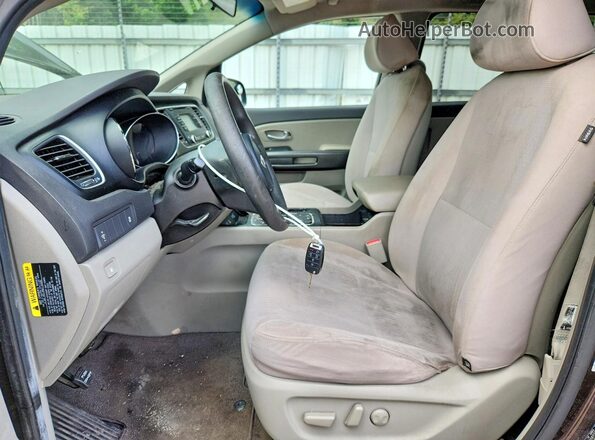 KNDMB5C10G6165972 2016 KIA SEDONA Brown Widok wnętrza z przodu