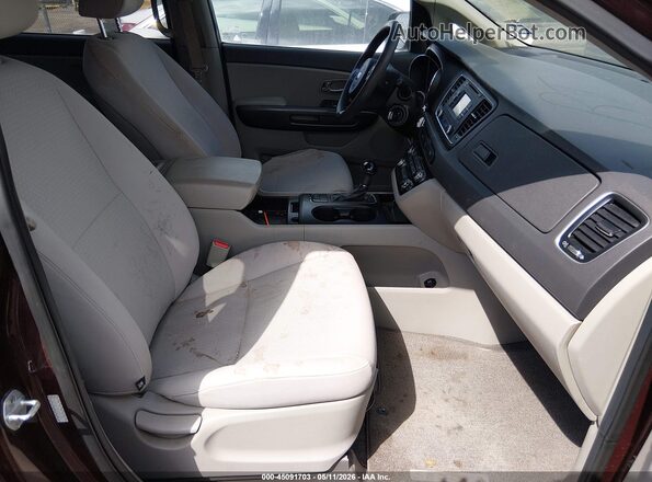KNDMB5C14G6107380 2016 KIA SEDONA Maroon Widok wnętrza z przodu