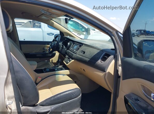 KNDMC5C17G6185035 2016 KIA SEDONA Золотой Вид салона спереди