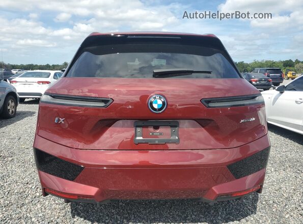 WB523CF00SCS46228 2025 BMW IX Burgundy Vista trasera