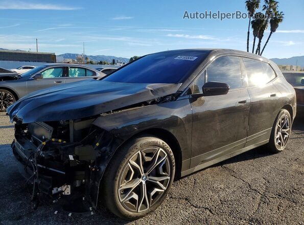 WB523CF01RCN95800 2024 BMW IX Black Vista tres cuartos delantera izquierda