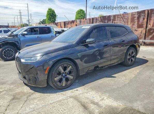 WB523CF08SCS11226 2025 BMW IX Charcoal Առջևի ձախ երեք քառորդ տեսարան