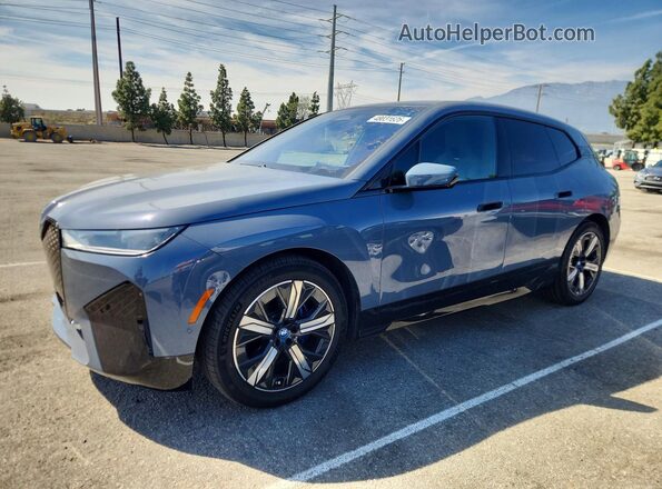 WB523CF0XPCM86507 2023 BMW IX Blue Vista tres cuartos delantera izquierda