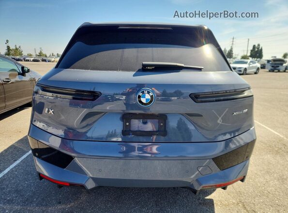 WB523CF0XPCM86507 2023 BMW IX Blue Vista trasera