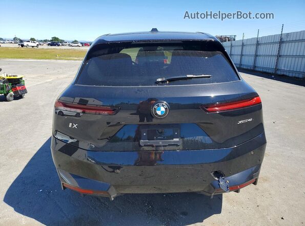 WB543CF06TCV37620 2026 BMW IX Black Vista trasera