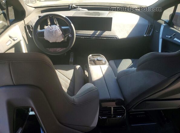 WB543CF08TCW71917 2026 BMW IX Black Vista del salpicadero