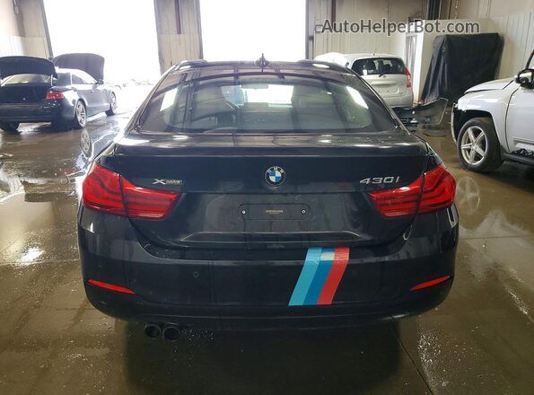 WBA4J3C50JBL03211 2018 BMW OTHER Black Vista trasera