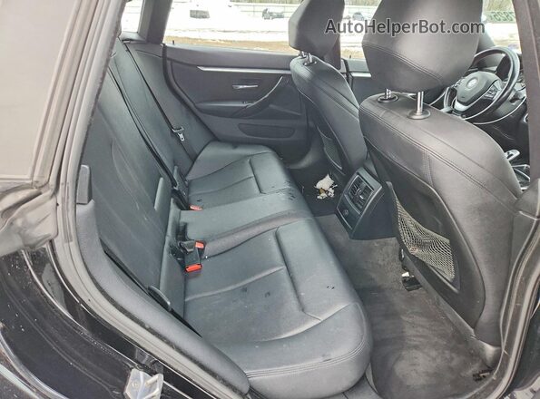 WBA4J3C55KBL08874 2019 BMW OTHER Charcoal Vista de los asientos traseros