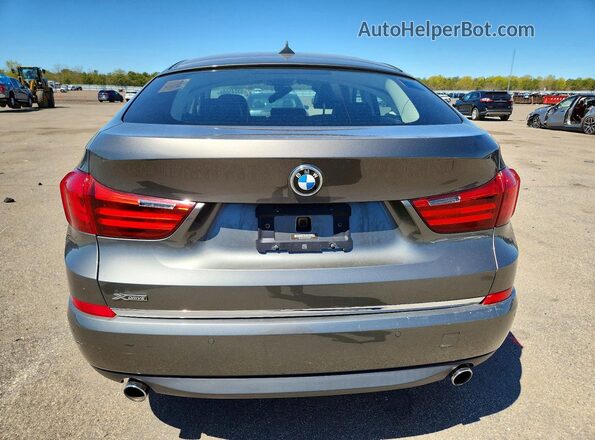 WBA5M4C57GD186581 2016 BMW OTHER Gray Вид ззаду