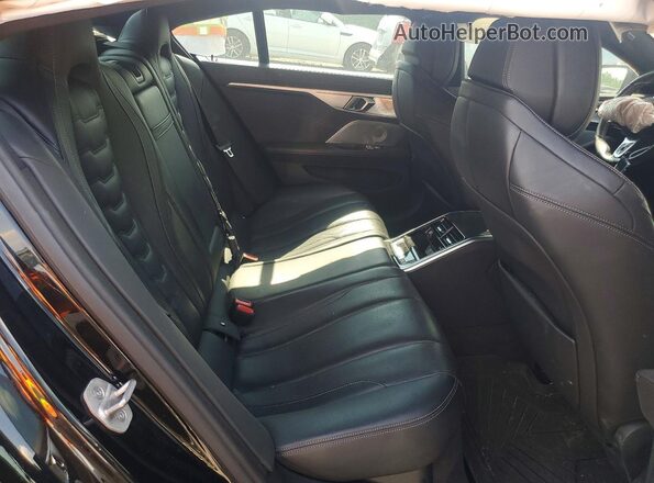WBAGV8C07RCR10036 2024 BMW M8 Black Vista de los asientos traseros