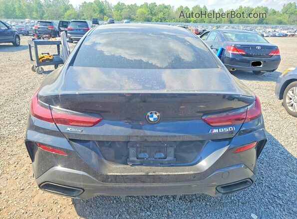 WBAGV8C07RCR10036 2024 BMW M8 Black Vista trasera