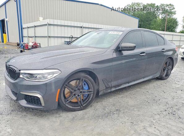 WBAJB9C51JB286017 2018 BMW M5 Charcoal Vista tres cuartos delantera izquierda