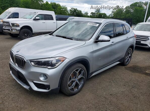 WBXHT3C31GP886321 2016 BMW X1 Серебряный Передняя левая четверть