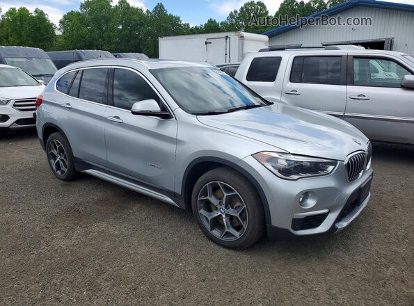 WBXHT3C31GP886321 2016 BMW X1 Серебряный Передняя правая четверть