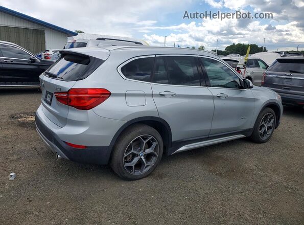 WBXHT3C31GP886321 2016 BMW X1 Серебряный Задняя правая четверть