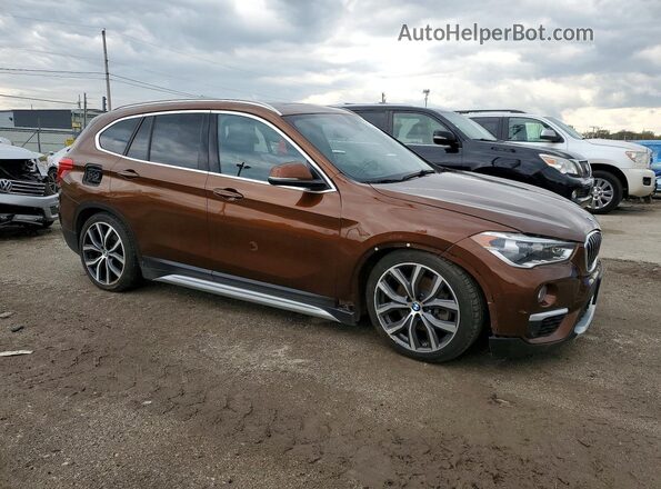 WBXHT3C31H5F67758 2017 BMW X1 Коричневый Передняя правая четверть