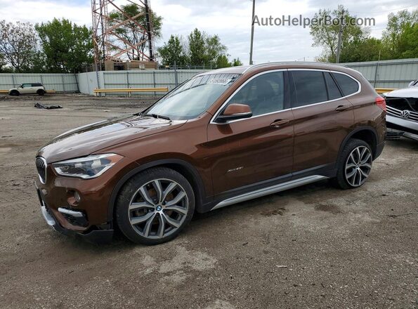 WBXHT3C31H5F67758 2017 BMW X1 Коричневый Передняя левая четверть