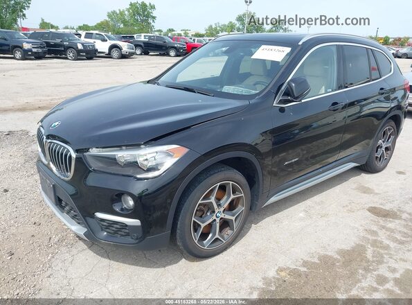 WBXHT3C32G5F63636 2016 BMW X1 Black Front left