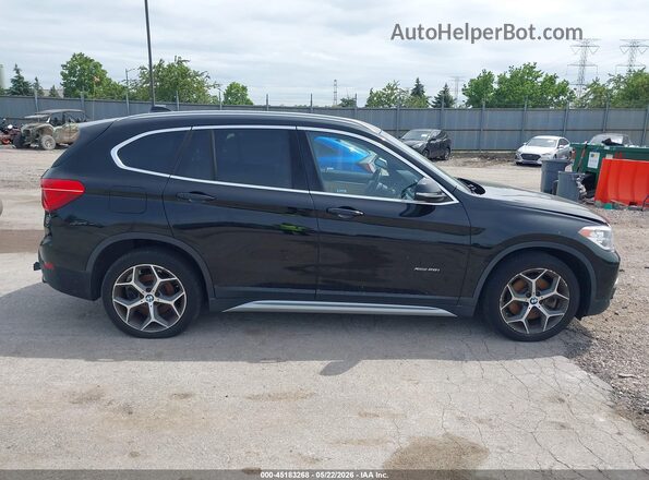 WBXHT3C32G5F63636 2016 BMW X1 Black Rear interior view