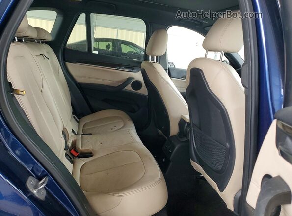 WBXHT3C33GP883260 2016 BMW X1 Blue Vista interior trasera