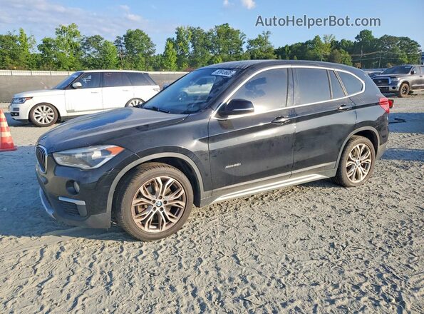 WBXHT3C34J5F92921 2018 BMW X1 Black Vista tres cuartos delantera izquierda