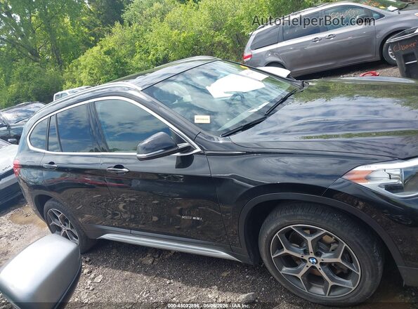WBXHT3C34J5L26666 2018 BMW X1 Черный Вид задней части салона