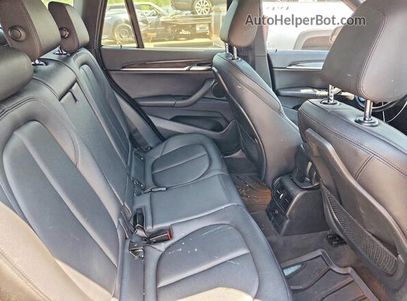 WBXHT3C34J5L27008 2018 BMW X1 Black Սալոնի հետևի տեսք