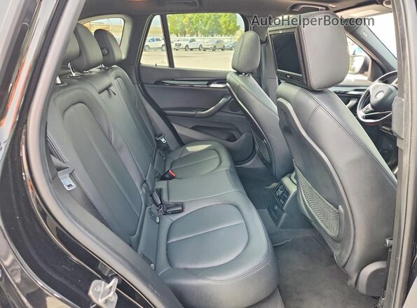 WBXHT3C36GP880188 2016 BMW X1 Black Widok tylnych siedzeń