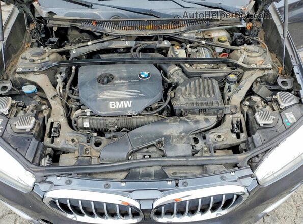 WBXHT3C36H5F84264 2017 BMW X1 Gray Vista interior trasera