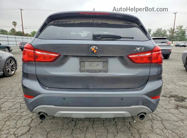 WBXHT3C36H5F84264 2017 BMW X1 Gray Vista trasera