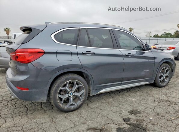 WBXHT3C36H5F84264 2017 BMW X1 Gray Trasero derecho