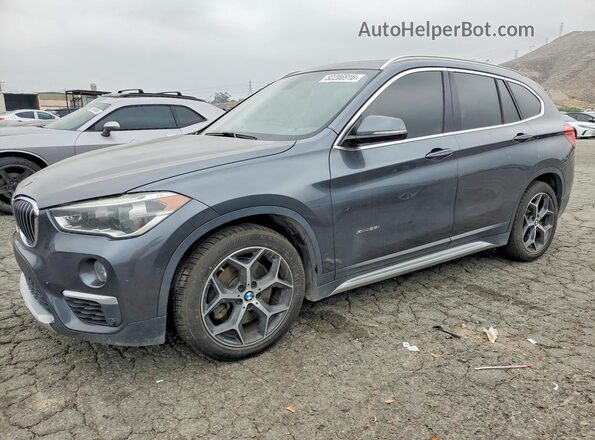 WBXHT3C36H5F84264 2017 BMW X1 Gray Vista tres cuartos delantera izquierda